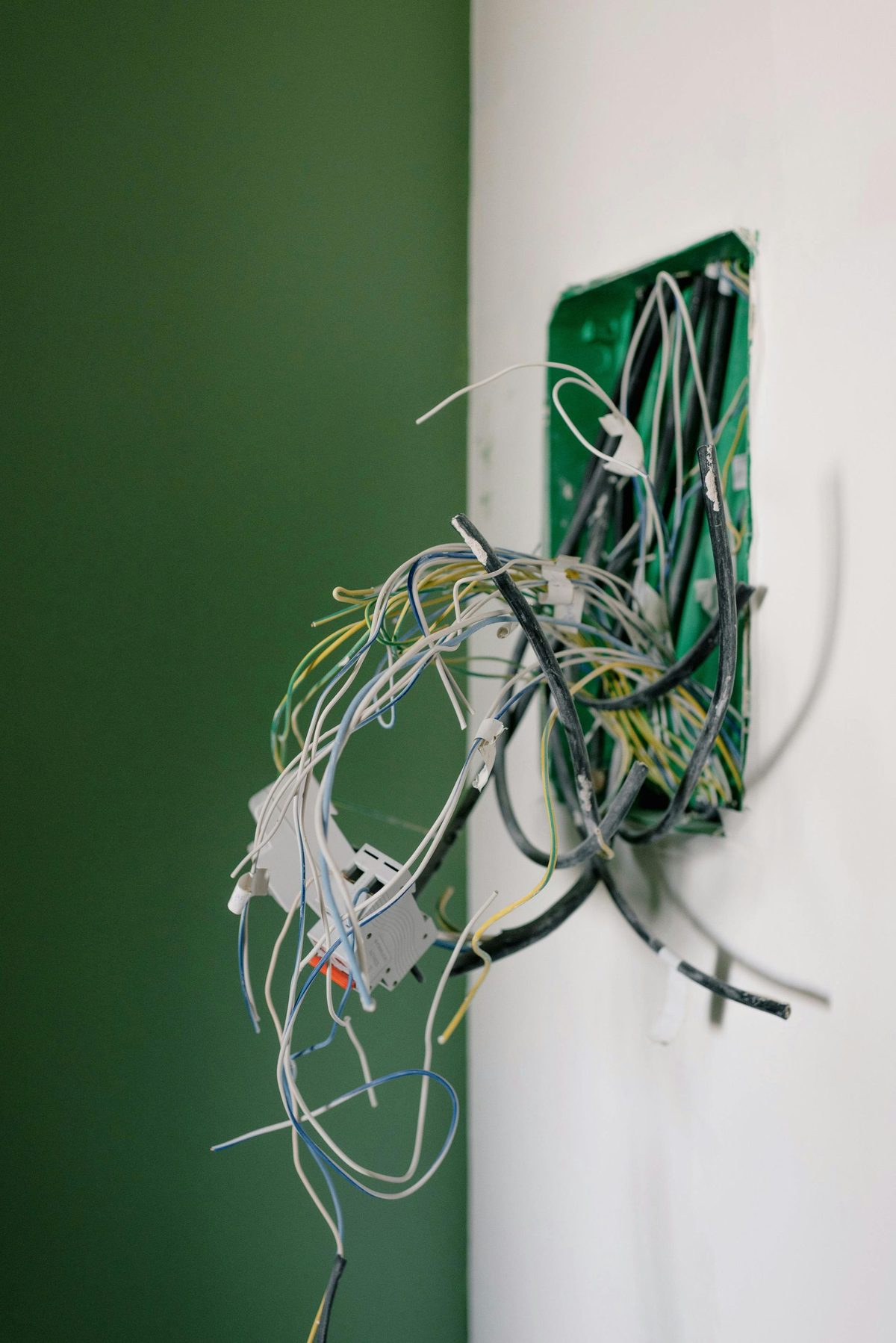 Electrician wiring an outlet.